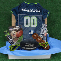 Seattle Seahawks NFL Pet Gift Box with 2 Licensed Dog Toys, 1 Logo-Engraved Natural Treat, 1 NFL Jersey, 1 Puppy Training Bell, and a Car Seat Belt